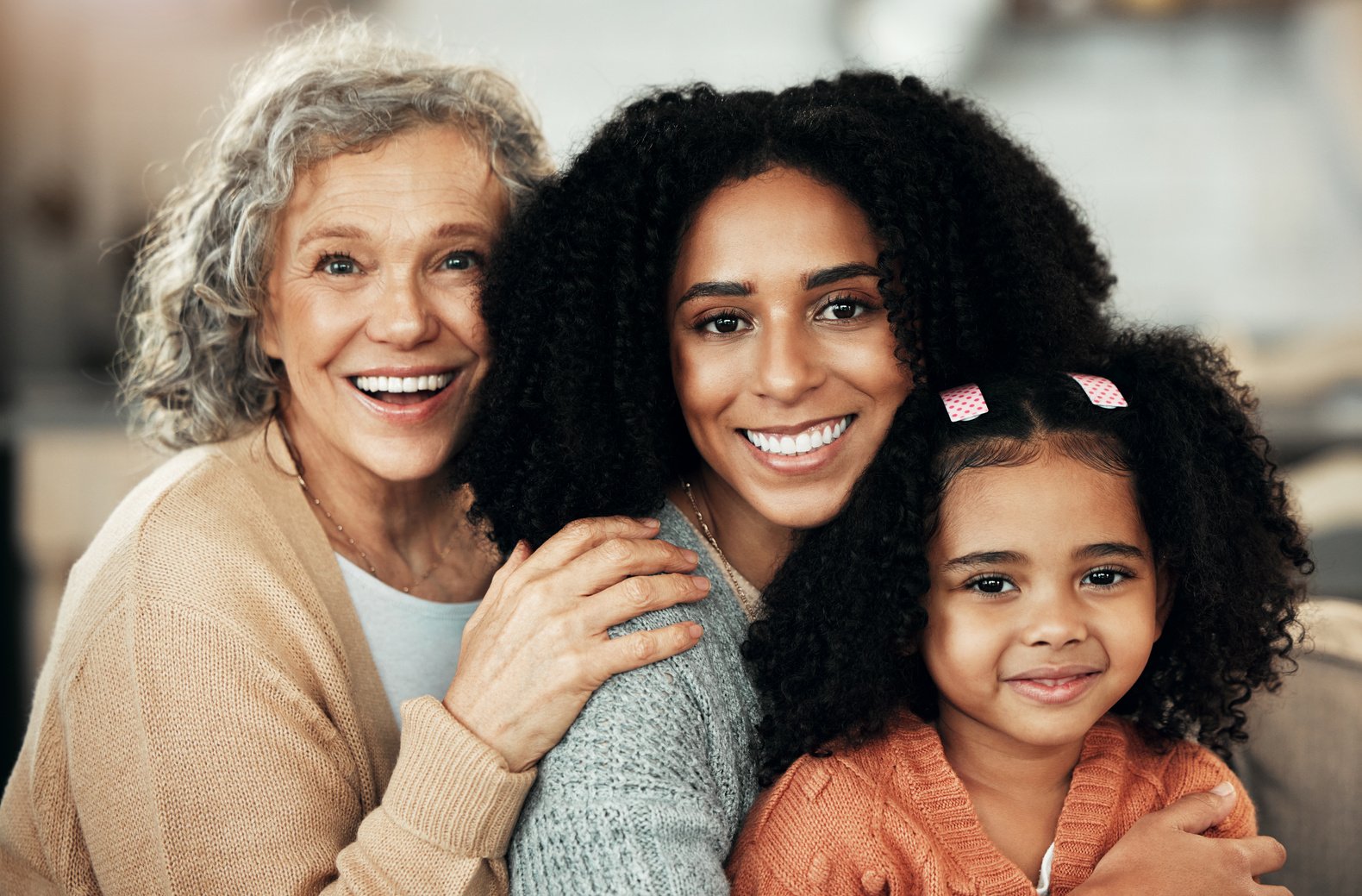 Grandmother, Mother, and Daughter Embracing Each Other 