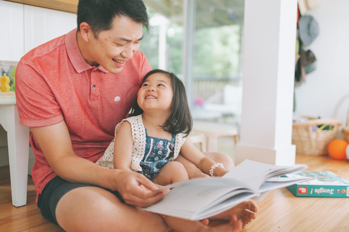 Father Reading to His Daughter at Home